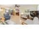 Open-concept living room flows into kitchen and dining area at 9065 Sw 82Nd Ter # G, Ocala, FL 34481