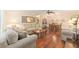 Cozy living room with hardwood floors, neutral decor, and comfortable seating at 9065 Sw 82Nd Ter # G, Ocala, FL 34481