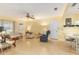 Cozy living room with light yellow walls, ceiling fan, and light wood-look flooring at 9065 Sw 82Nd Ter # G, Ocala, FL 34481