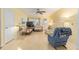 Bright living room with a ceiling fan, natural light, and comfortable seating at 9065 Sw 82Nd Ter # G, Ocala, FL 34481