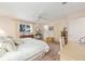 Serene main bedroom featuring soft lighting, a ceiling fan, and a comfortable bed at 9065 Sw 82Nd Ter # G, Ocala, FL 34481
