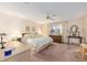 Spacious main bedroom with carpet, ceiling fan, and natural light at 9065 Sw 82Nd Ter # G, Ocala, FL 34481