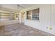 Enclosed sunroom with tile floors and multiple windows, perfect for relaxation at 9065 Sw 82Nd Ter # G, Ocala, FL 34481