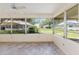 Bright sunroom with tile flooring and a view of the backyard at 9065 Sw 82Nd Ter # G, Ocala, FL 34481