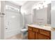 Bathroom with shower and tub, granite countertops, updated lighting, and tiled floors at 9415 Se 125Th St, Summerfield, FL 34491