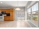 Bright eat-in kitchen area with tile floors, many windows, and ample natural light at 9415 Se 125Th St, Summerfield, FL 34491