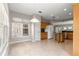 Open-concept kitchen with tile flooring, stainless steel appliances, and granite countertops at 9415 Se 125Th St, Summerfield, FL 34491