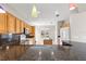 Granite countertops, wooden cabinetry, and an island highlight this kitchen at 9415 Se 125Th St, Summerfield, FL 34491
