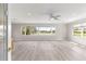 Living room showcases hardwood floors, recessed lighting, and a view of the water at 9415 Se 125Th St, Summerfield, FL 34491