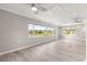 Living room features hardwood floors, recessed lighting, and a view of the lake at 9415 Se 125Th St, Summerfield, FL 34491