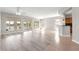 Spacious living room with ample natural light and scenic lake views at 9415 Se 125Th St, Summerfield, FL 34491