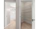 View of bathroom with white tiled shower/bath and an open walk-in closet with wire shelving at 9415 Se 125Th St, Summerfield, FL 34491