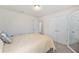 Bedroom with carpet, a queen bed, mirrored closet doors, and a window at 9562 Sw 45Th Ave, Ocala, FL 34476