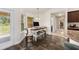 Cozy breakfast nook featuring a desk, pendant lighting, and a view of the backyard at 9562 Sw 45Th Ave, Ocala, FL 34476