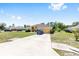 Inviting single-story home featuring a well-manicured lawn, spacious driveway, and an attached two-car garage at 9562 Sw 45Th Ave, Ocala, FL 34476