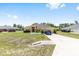 Attractive one-story home with a well-kept lawn and a long driveway leading to the attached two-car garage at 9562 Sw 45Th Ave, Ocala, FL 34476