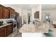 Spacious kitchen with granite countertops, stainless steel appliances, and dark wood cabinetry at 9562 Sw 45Th Ave, Ocala, FL 34476