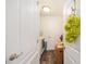 Cozy laundry room featuring wood-look flooring and a washer and dryer at 9562 Sw 45Th Ave, Ocala, FL 34476