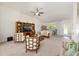 Open-concept living room with high ceilings, lots of natural light, stylish furniture, and a ceiling fan at 9562 Sw 45Th Ave, Ocala, FL 34476