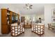 Open-concept living room featuring a ceiling fan and comfortable seating arrangement at 9562 Sw 45Th Ave, Ocala, FL 34476