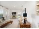 Bright living room featuring neutral tones, modern furniture, large windows, and stylish decor at 9562 Sw 45Th Ave, Ocala, FL 34476