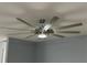 Modern ceiling fan with integrated lighting enhances the contemporary interior of this home at 9706 Sw 92Nd Place Rd, Ocala, FL 34481