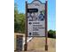 Sign displaying community amenities, guiding residents to softball, horseshoes, and hobby building at 9706 Sw 92Nd Place Rd, Ocala, FL 34481
