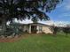 Charming single-story home with well-maintained lawn, mature trees, and tasteful landscaping at 9706 Sw 92Nd Place Rd, Ocala, FL 34481