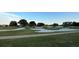 Scenic view of a golf course with sand traps and well-manicured greenways at 9706 Sw 92Nd Place Rd, Ocala, FL 34481