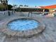 Inviting community hot tub with clear blue water and a well-maintained brick deck at 9706 Sw 92Nd Place Rd, Ocala, FL 34481
