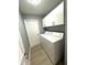 Laundry room with washer, dryer, and storage cabinets at 9706 Sw 92Nd Place Rd, Ocala, FL 34481