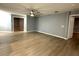 Spacious living room featuring plank flooring and an open layout with ample natural light at 9706 Sw 92Nd Place Rd, Ocala, FL 34481