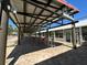 Spacious outdoor patio with shaded seating, perfect for relaxation and socializing at 9706 Sw 92Nd Place Rd, Ocala, FL 34481