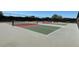 Outdoor pickleball courts with nets and green and red playing surfaces; community recreational amenity at 9706 Sw 92Nd Place Rd, Ocala, FL 34481
