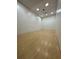 Indoor racquetball court with hardwood floor and white walls; recreational amenity at the community at 9706 Sw 92Nd Place Rd, Ocala, FL 34481