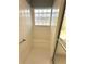 Shower with built-in seat and window of glass blocks for natural light at 9706 Sw 92Nd Place Rd, Ocala, FL 34481