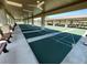 Covered shuffleboard courts with benches offering a shaded recreation area at 9706 Sw 92Nd Place Rd, Ocala, FL 34481