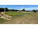 Well-maintained softball field with fencing, green grass, and a visible outfield at 9706 Sw 92Nd Place Rd, Ocala, FL 34481