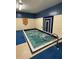 Indoor spa with hot tub, blue tile and handrail. Community recreational amenity at 9706 Sw 92Nd Place Rd, Ocala, FL 34481