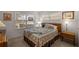 Comfortable bedroom with natural light and a cozy bed at 9710 Sw 96Th St, Ocala, FL 34481