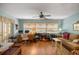 Bright room with natural light, wood floors, and comfortable seating at 9710 Sw 96Th St, Ocala, FL 34481