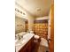 Full bathroom with vanity, mirror, toilet, and shower/tub with a pattern curtain at 16905 Sw 30Th Avenue Rd, Ocala, FL 34473