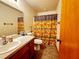 Full bathroom with vanity, mirror, toilet, and shower/tub with a unique curtain at 16905 Sw 30Th Avenue Rd, Ocala, FL 34473