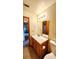 Full bathroom featuring a vanity with a mirror, toilet, and tile flooring at 16905 Sw 30Th Avenue Rd, Ocala, FL 34473