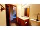 Standard bathroom featuring a vanity with a mirror, toilet, and tile flooring at 16905 Sw 30Th Avenue Rd, Ocala, FL 34473