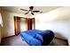 Simple bedroom with a ceiling fan and carpet flooring at 16905 Sw 30Th Avenue Rd, Ocala, FL 34473