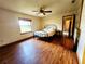 Bright bedroom featuring wood flooring, and a ceiling fan at 16905 Sw 30Th Avenue Rd, Ocala, FL 34473