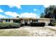 Charming single-story home featuring a neutral exterior, tidy landscaping, and an attached one-car garage at 16905 Sw 30Th Avenue Rd, Ocala, FL 34473