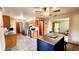 This well-lit kitchen offers tiled floors, a center island, wooden cabinets, and stainless steel appliances at 16905 Sw 30Th Avenue Rd, Ocala, FL 34473