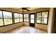 The sunroom boasts black framed windows offering natural light and outdoor views at 16905 Sw 30Th Avenue Rd, Ocala, FL 34473